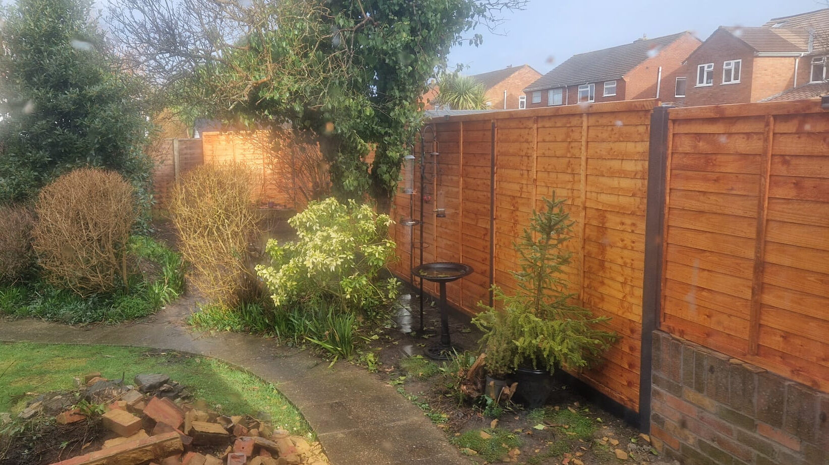 New garden fence installation during a Surrey family home renovation using DuraPost fencing panels