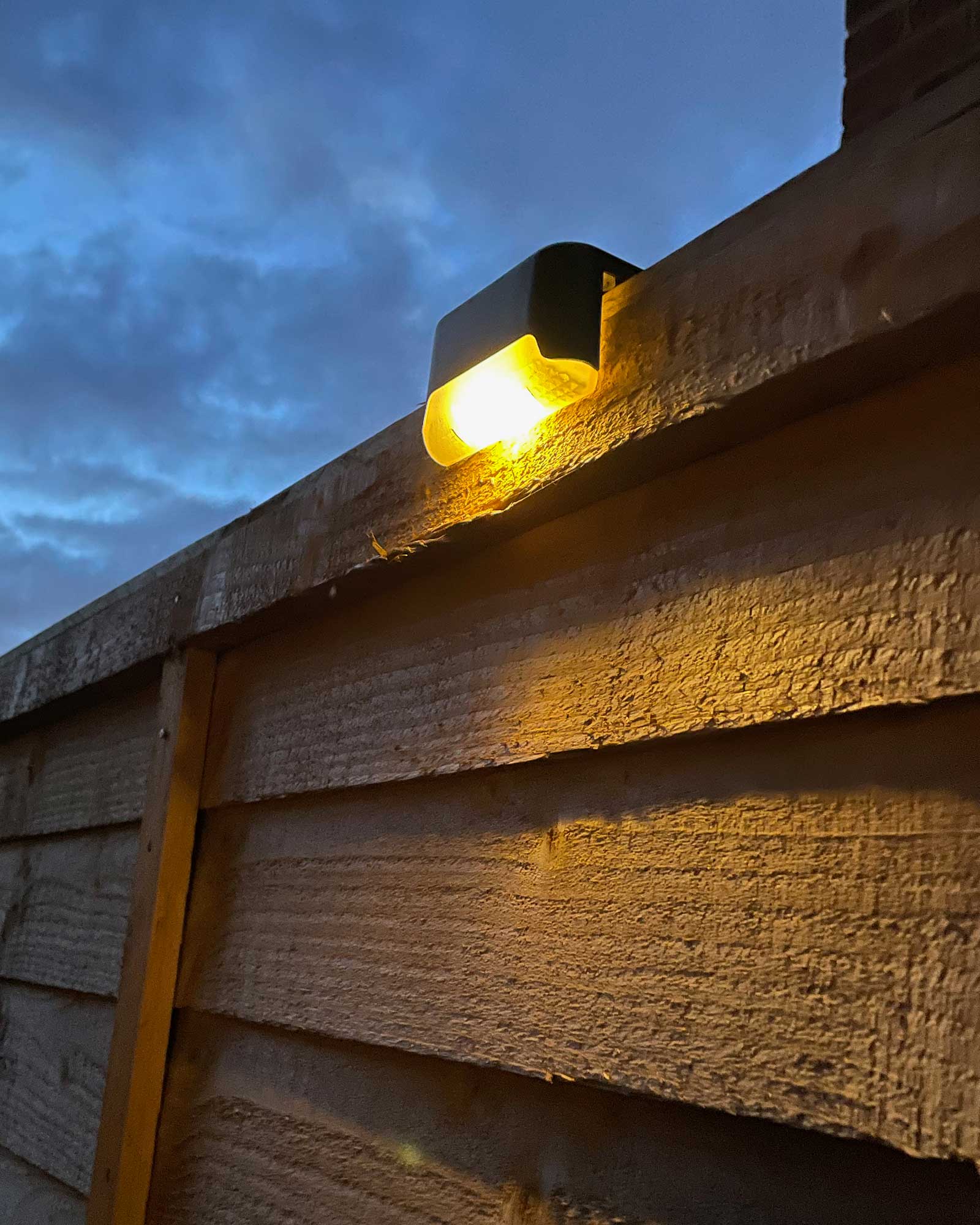 Warm solar deck lights used to add ambient evening lighting to the Surrey renovation garden