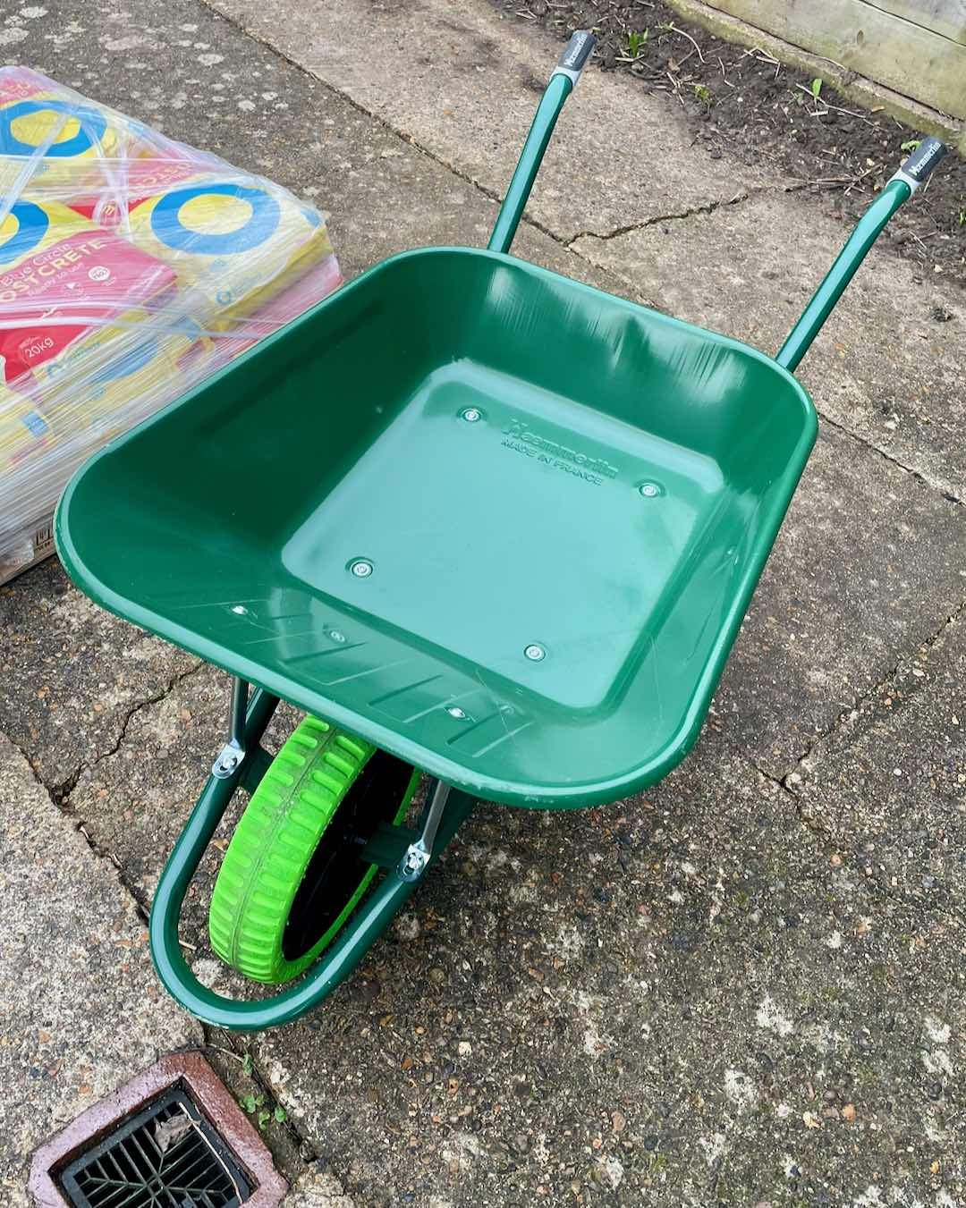 Green Haemmerlin 90L trade wheelbarrow with puncture proof tire