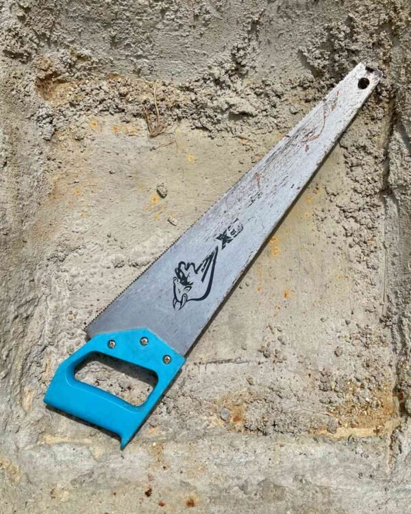 Blue and black OX Trade 20-inch hand saw cutting smoothly through structural timber timber.
